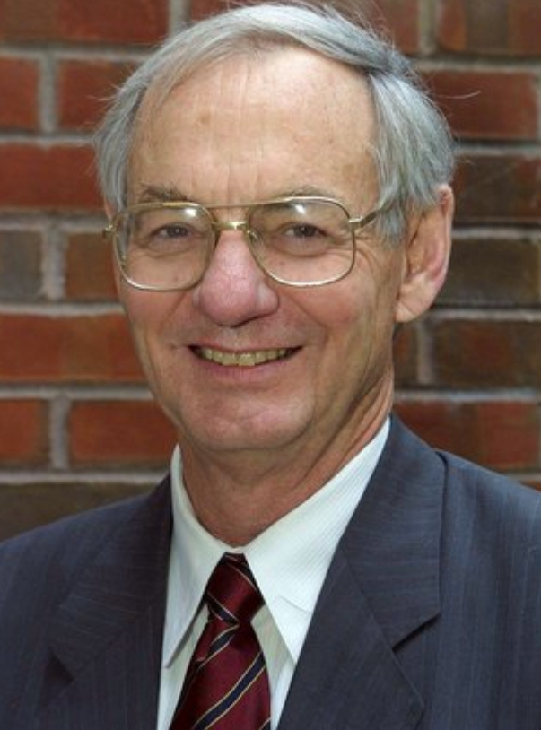 Smiling head and shoulders image of Paul Jennings in tie and suit jacket
