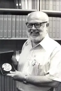 William Fowler holding his National Medal of Science