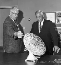 Bruce Rule and Lee DuBridge looking at model of 130′ antenna