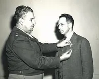 Robert Bacher receiving Medal for Merit from Gen. Leslie Groves