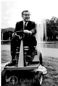 Harold Brown driving lawn mower on campus