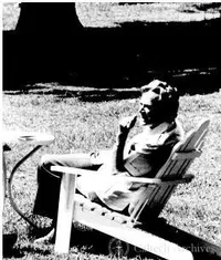 Richard Feynman relaxing in a lawn chair at Shelter Island Conference
