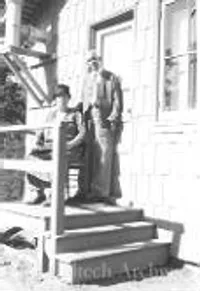 A. A. Noyes and Mary McSweeney on porch of cottage in Big Pines