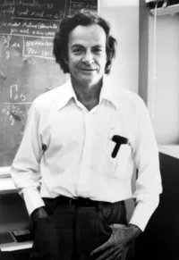 Richard Feynman, casual pose before blackboard