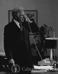 Marvin Goldberger on phone in office