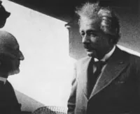 Einstein with a local priest