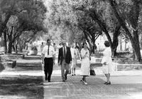 Marvin Goldberger strolling on the Olive Walk with Hardy Martel
