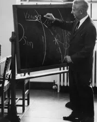 Lee DuBridge lecturing at blackboard