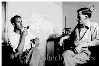 George Beadle smoking pipe with unidentified man.