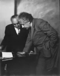 Einstein standing with Walther Mayer