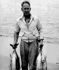 George Beadle carrying fish
