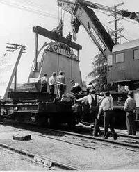 Unloading 200″ disc from railway car