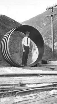 Henry Case in section of penstock pipe, LA Aqueduct