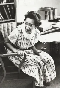 Olga Taussky Todd, sitting in office wearing “numbers” dress