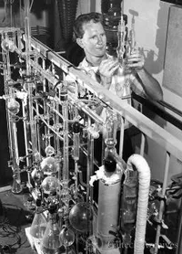 Unidentified man with equipment used in low temperature physics