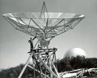 John Bolton on the 32-foot diameter radio telescope on Palomar Mountain