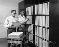 James McClanahan (left) and Hendrik Rubingh (right) filing original Sky Survey Atlas plates in Robinson Laboratory