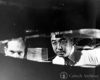 Unidentified man and Henry T. Nagamatsu working with the hypersonic wind tunnel