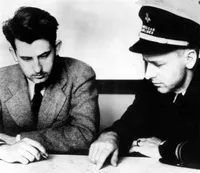 Irving Krick and Leland S. Andrews conferring on weather conditions