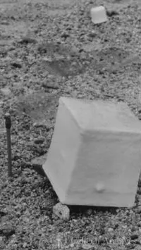 Overturned 6-inch hydrocal cube, 2-inch cube in background