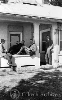 Edwin Hubble (sitting with back to post) and a group of men