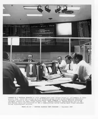 In the control room at JPL, members of the mission team keep tabs on a Surveyor moonship