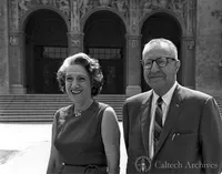 Henry and Ida Weitzel standing in front of Throop Hall