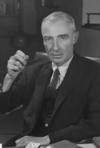 J. Robert Oppenheimer seated with pipe
