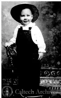 Young George Beadle wearing his first pair of overalls